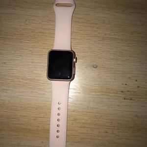 Pink Apple Watch with band and charger